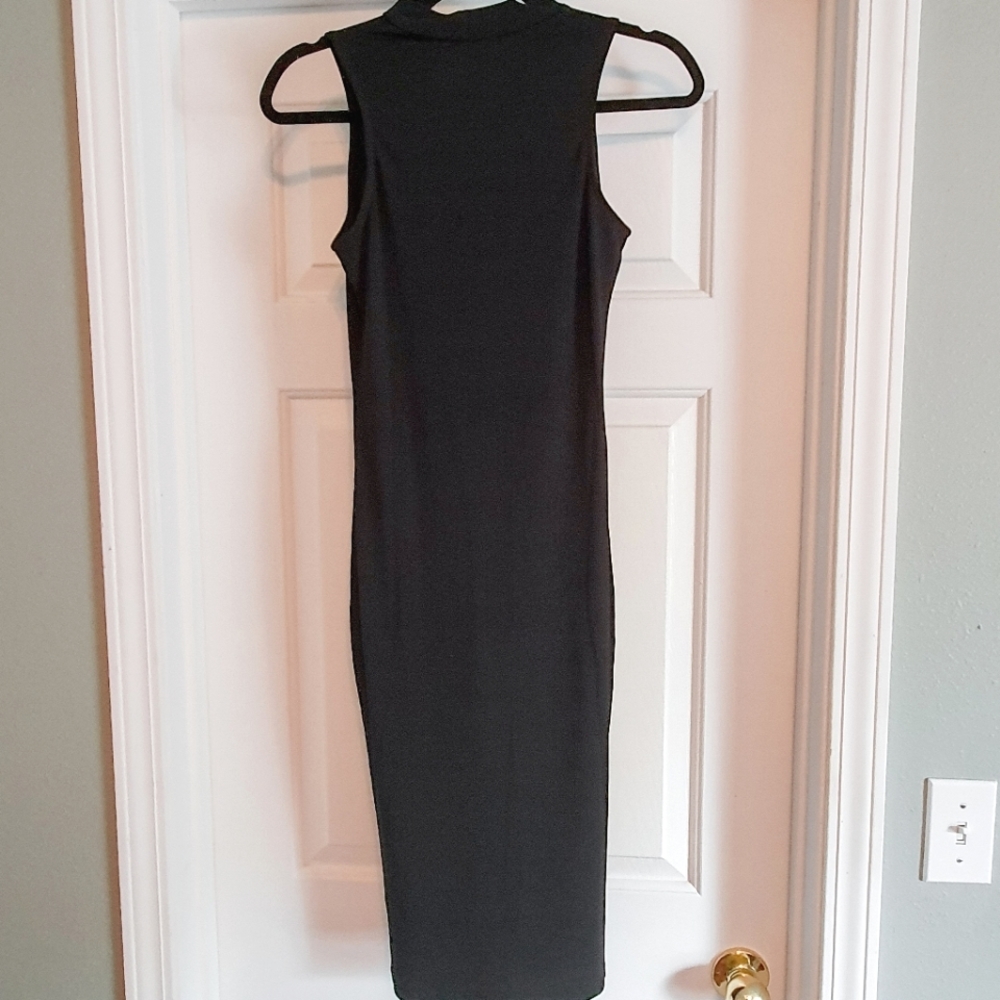 Form-fitting black midi dress with cutout